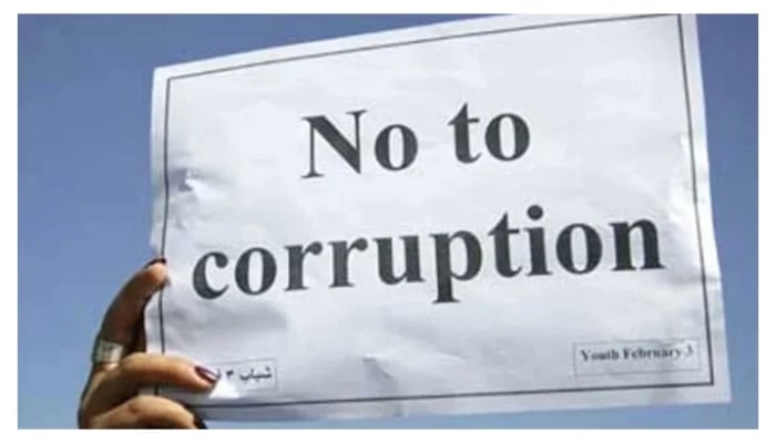 This representational image shows No to corruption on a placard. — Reuters/File