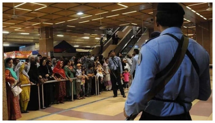 This picture shows Pakistani Airports Security Force personnel standing guard at Jinnah International Airport in Karachi. — AFP/File