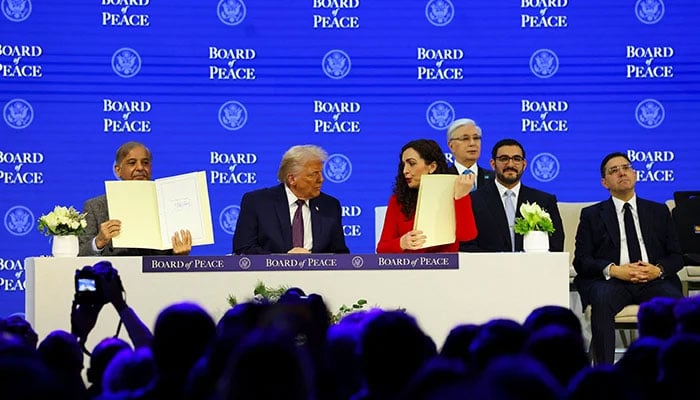 Prime Minister Shehbaz Sharif and President of Kosovo Vjosa Osmani hold signed Charter of the Board of Peace next to US President Donald Trump, as they take part in a charter announcement for his Board of Peace initiative alongside the 56th annual World Economic Forum (WEF), in Davos, Switzerland, January 22, 2026. — Reuters