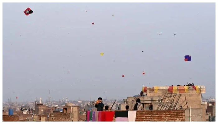 People fly kites during the Basant festival in Lahore on February 6, 2026. — AFP