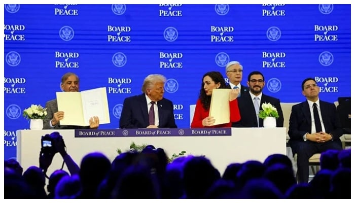 Prime Minister Shehbaz Sharif and President of Kosovo Vjosa Osmani hold signed Charter of the Board of Peace next to US President Donald Trump, as they take part in a charter announcement for his Board of Peace initiative alongside the 56th annual World Economic Forum (WEF), in Davos, Switzerland, January 22, 2026. — Reuters