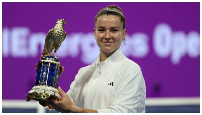 Czech Republics Karolina Muchova poses with the trophy as she celebrates after winning her final match against Canadas Victoria Mboko on February 14, 2026.— Reuters