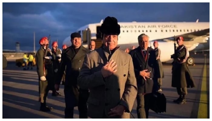 Prime Minister Shehbaz Sharif walks to his official vehicle after arriving in Vienna, Austria, on February 15, 2026. — APP