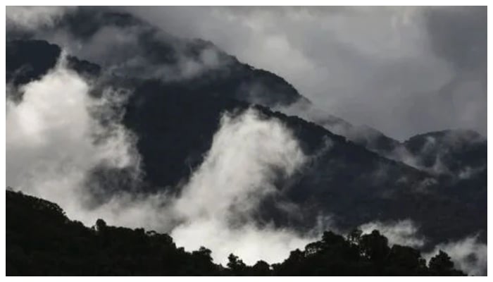 Heavy clouds envelop the mountain range. —AFP/File