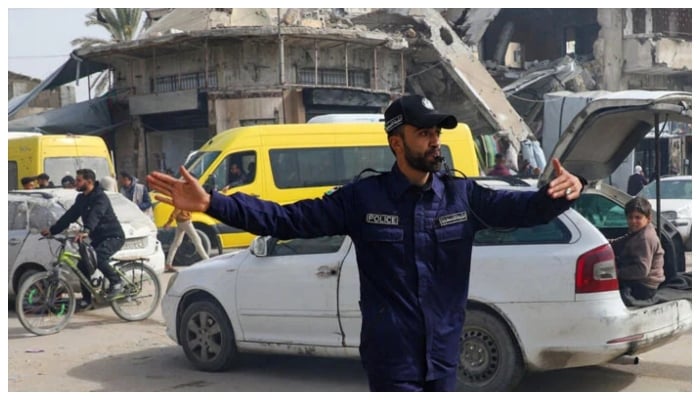 A Hamas police officer directs traffic in Gaza City on January 28, 2026.— Reuters