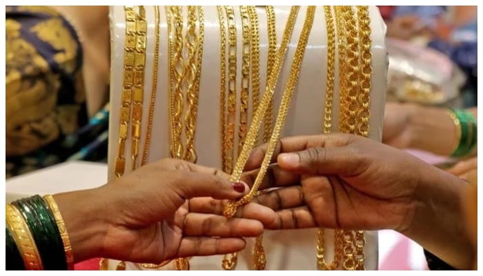 A representational image of customers looking at gold chains. — Reuters/File