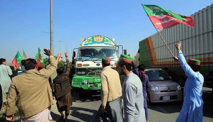 Activists of Tehreek-e-Insaf (PTI) block roads during a protest in KP. — PPI/File
