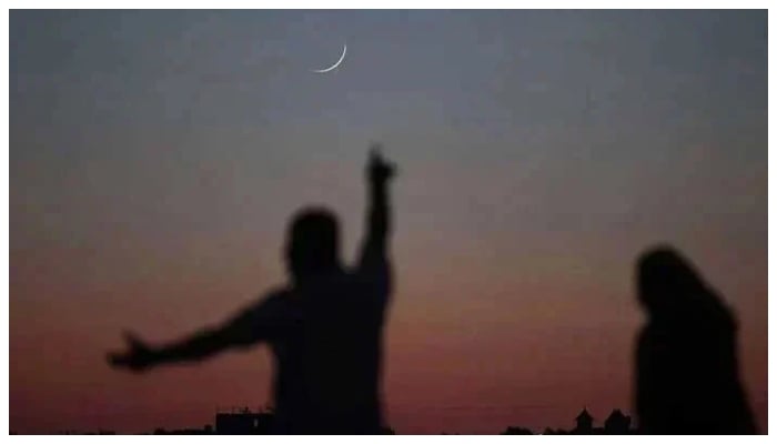 A man reacting after spotting the crescent in the sky. — AFP/File