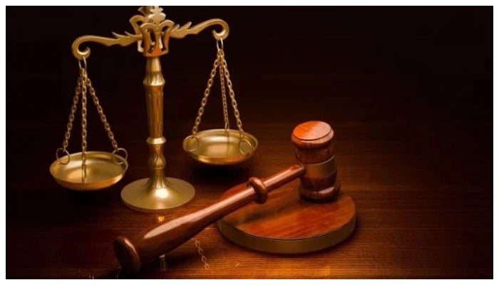 A representational image of scales of justice and a gavel. — Unsplash/File