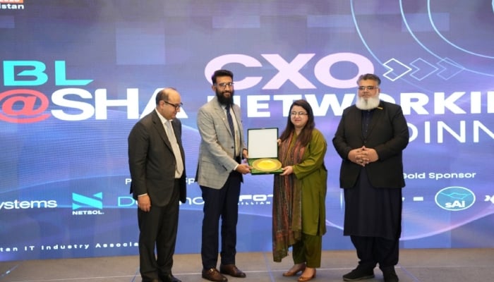 Minister for IT and Telecommunication Shaza Fatima Khawaja (second from right) presents Devsinc CEO Usman Asif with an appreciation shield during INDUS AI WEEK. — Facebook/Devsinc