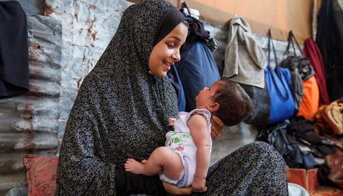 Rana Salah and daughter Milana, Deir Al-Balah, Gaza, September 10, 2024. — Reuters