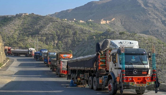 The representational image shows trucks parked along a road near the Pakistan-Afghanistan border in Torkham on September 11, 2023. — AFP