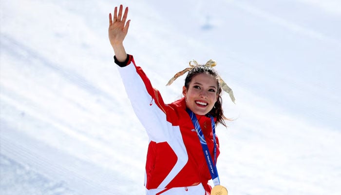 Gold medallist Ailing Eileen Gu of China celebrates on the podium during the womens freeski halfpipe victory ceremony. —Reuters