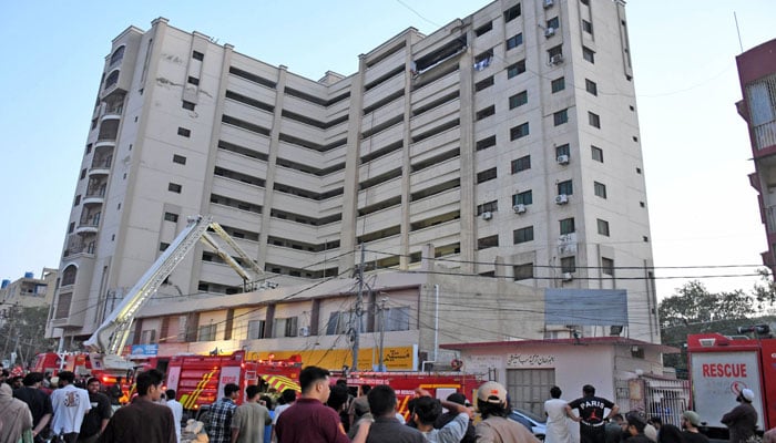 Rescue workers are busy at the site after a gas cylinder explosion at a residential building in the Hyderi in North Nazimabad, Karachi, on February 22, 2026. — Online