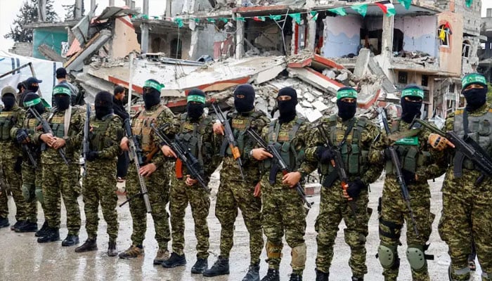 Palestinian Hamas members stand guard on the day of the handover of hostages held in Gaza since the deadly October 7 2023 attack, as part of a ceasefire and a hostages-prisoners swap deal between Hamas and Israel, in Rafah in the southern Gaza Strip, February 22, 2025. — Reuters