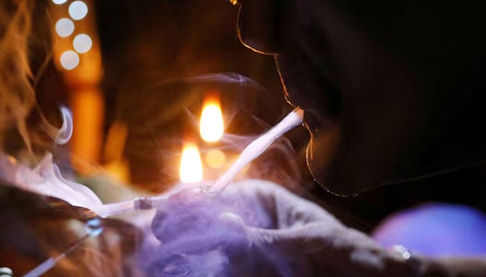 This representational image shows a drug user inhaling Shabu, or methamphetamine, at a drug den. — Reuters/File