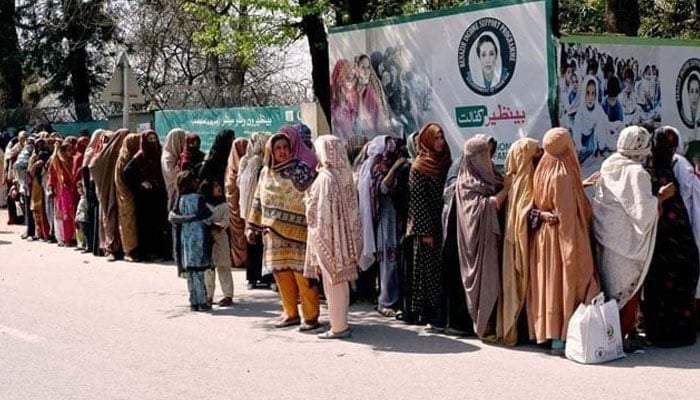 This representational image shows women standing in a queue to draw money from the Benazir Income Support Programme (BISP) outside the Benazir One Window Center. — APP/File