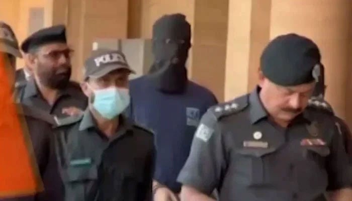 Police escort Armaghan, prime suspect in Mustafa Amir murder case during an appearance before SHC on February 18, 2025. — Screengrab via Geo News