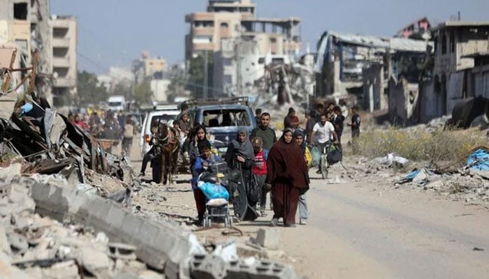 Displaced Palestinians ordered by the Israeli military to evacuate the northern part of Gaza flee amid an Israeli military operation, in Jabalia in the northern Gaza Strip, October 22, 2024.—Reuters