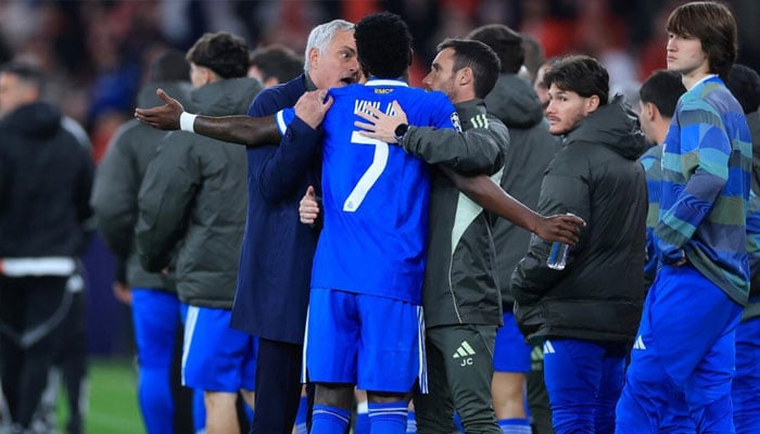 Real Madrids Brazilian forward Vinicius Junior talks with Benficas coach Jose Mourinho in the aftermath of the alleged first-leg racial abuse. —AFP/File