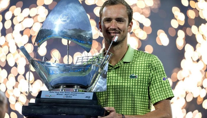 Daniil Medvedev posing with the trophy. —AFP