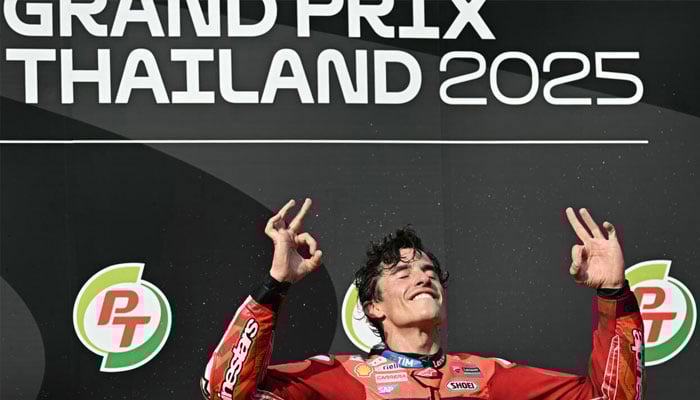 Ducati Lenovos Spanish rider Marc Marquez celebrates on the podium after winning the Thia MotoGP. —AFP/File