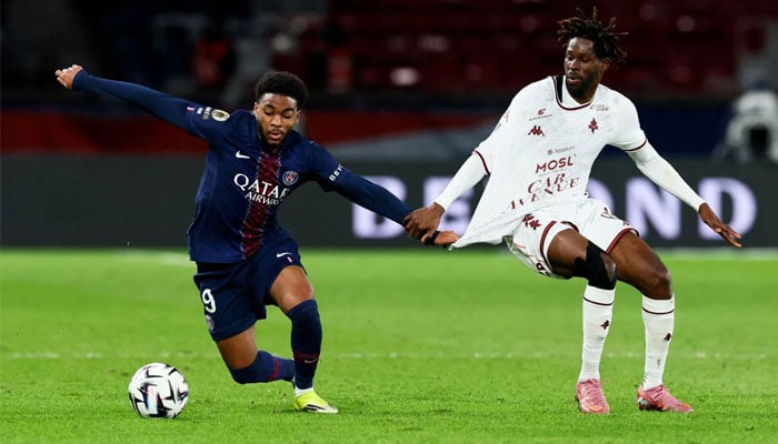Paris St Germains Ibrahim Mbaye in action with FC Metzs Boubacar Traore.—Reuters/File