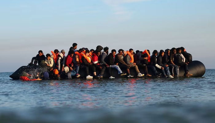A group of migrants on an inflatable dinghy leave the beach of Petit-Fort-Philippe in northern France in an attempt to cross the English Channel to reach Britain, in Gravelines, near Calais, France, September 27, 2025.—Reuters