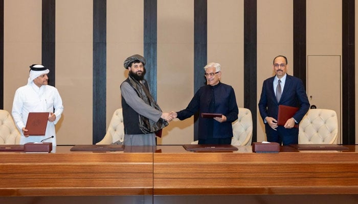 Defence Minister Khawaja Asif shakes hands with his Afghan counterpart Mullah Yaqoob after reaching a ceasefire deal with the Taliban regime in Doha, Qatar, on October 18, 2025. — X@KhawajaMAsif