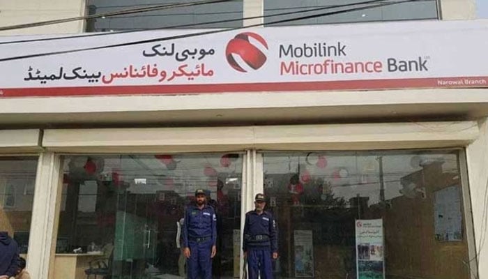 Security guards standing alert outside Mobilink Microfinance Bank Narowal branch. — Facebook@MobilinkMicrofinanceBankLimited/File