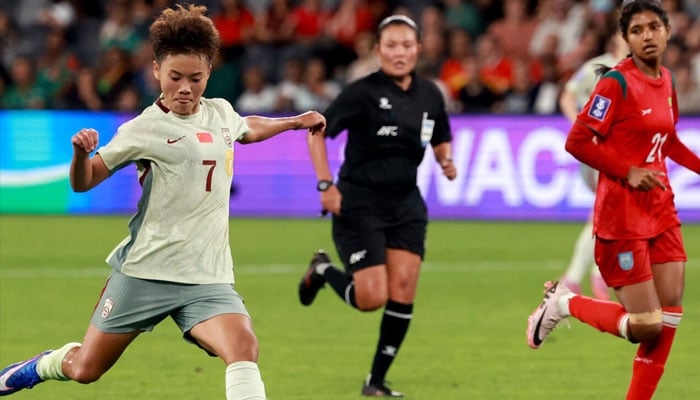 Chinas Wang Shuang (left) in action. —AFP