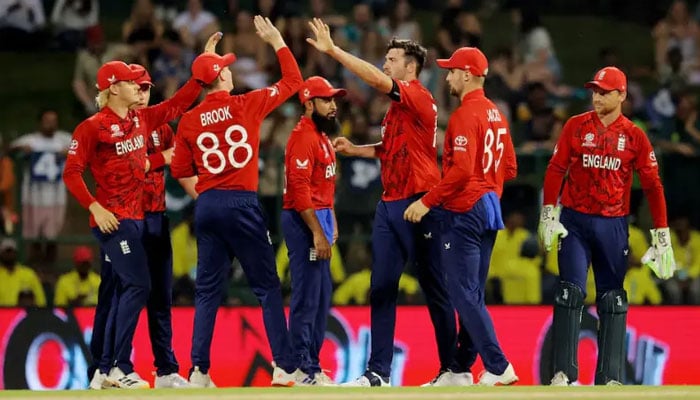 England’s cricket team celebrates after taking a wicket. — Reuters/File