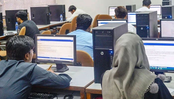 This representational image shows students attempting a computer-based test. — water.muet.edu.pk/File