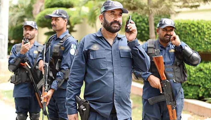 This representational image shows private security guards standing for a photo. — The News/File