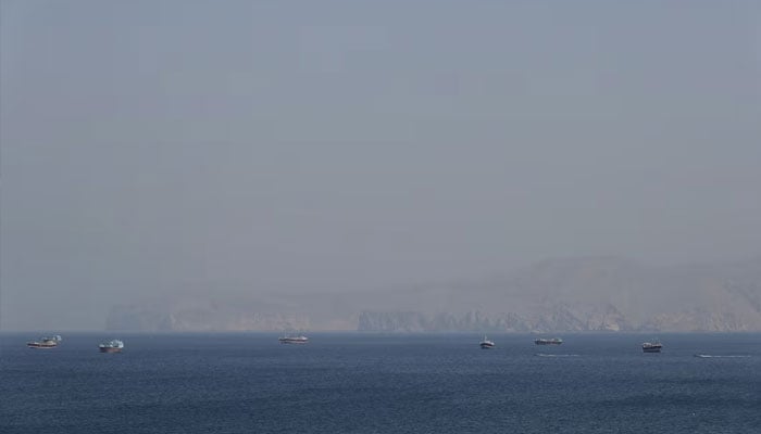 Boats in the Strait of Hormuz amid the US-Israeli conflict with Iran, as seen from Musandam, Oman, March 2, 2026.—Reuters