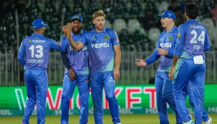 Multan Sultans David Willey (centre) celebrates taking a wicket with teammates during their PSL 10 match against Islamabad United at the Rawalpindi Cricket Stadium in Rawalpindi on April 16, 2025. — PSL