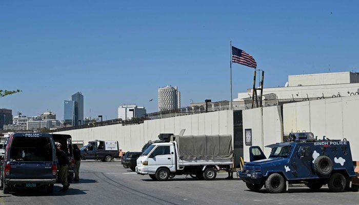 Police stand guard outside the US consulate in Karachi on March 4, 2026. — AFP