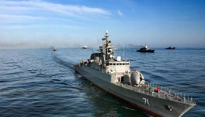 Iranian Navy frigate IRIS Alvand (71) during joint military drills between Iran, Russia, and China in the Gulf of Oman. —AFP/File