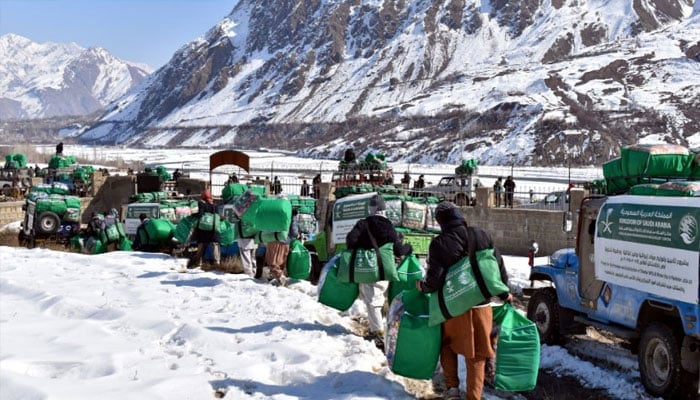 People carrying winter kits received from KSrelief, February 12, 2025. — Radio Pakistan