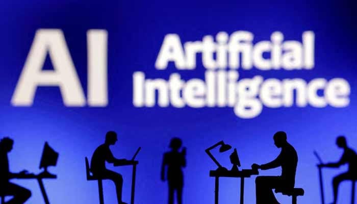 Figurines with computers and smartphones are seen in front of the words Artificial Intelligence AI in this illustration taken, February 19, 2024.— Reuters/File