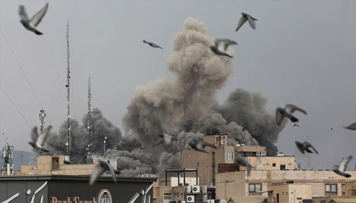 Smoke rises over Tehran on March 2, amid U.S. and Israeli attacks on the Iranian capital. With most of its proxies severely weakened, the Islamic Republic is facing its most perilous moment largely alone. —Reuters