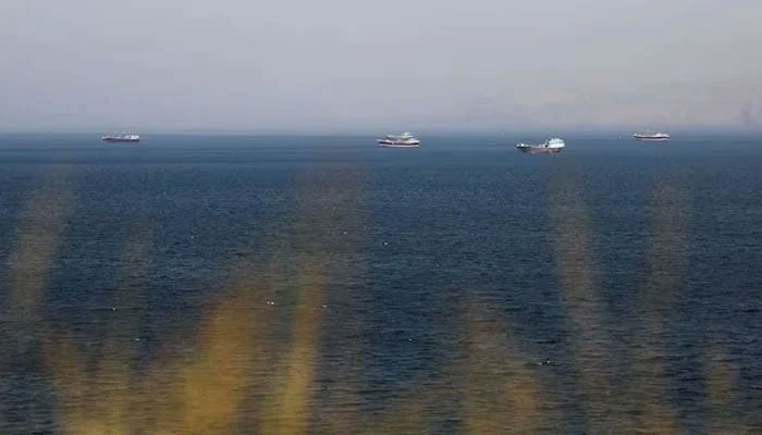 Boats in the Strait of Hormuz amid the US-Israeli conflict with Iran, as seen from Musandam, Oman, March 2, 2026.—Reuters