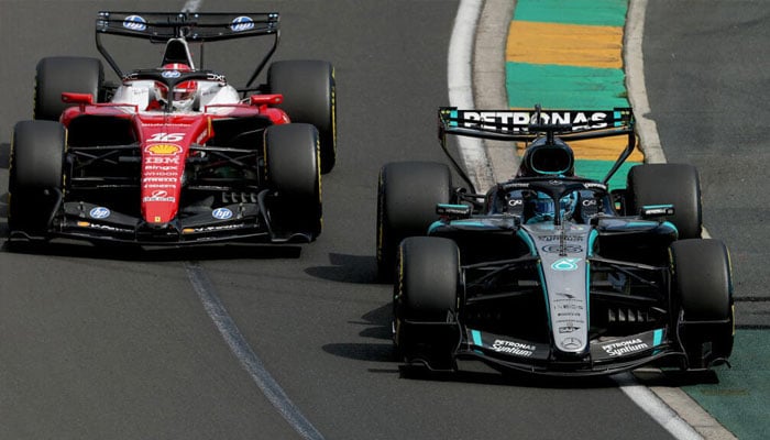 MercedesGeorge Russell (right) competes with Ferraris Charles Leclerc during the Australian Grand Prix. —AFP