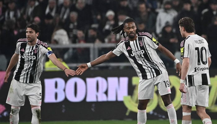 Juventus Khephren Thuram (centre) celebrates with Manuel Locatelli (left) after scoring the second goal during the Italian Serie A football match between Juventus and Pisa at the Allianz Stadium in Turin. —AFP