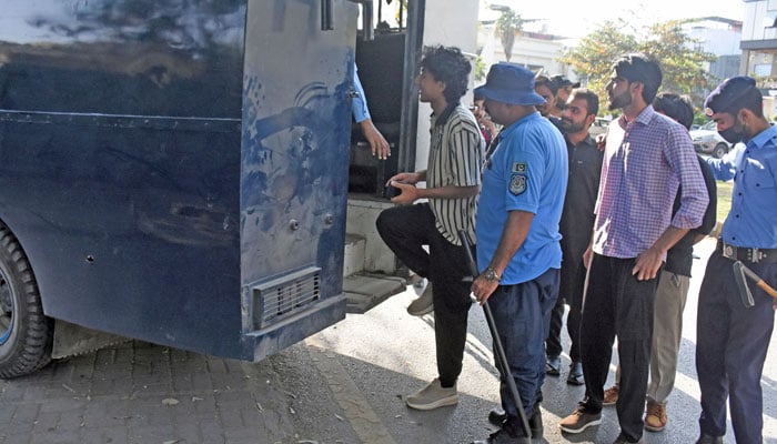 Police personnel detain activists of the womens rights group Aurat March, upon their arrival ahead of a rally on International Womens Day in Islamabad on March 8, 2026. — Online