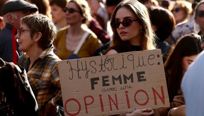 Hysterical: woman with an opinion, read one sign as thousands marched for womens rights Sunday. —AFP