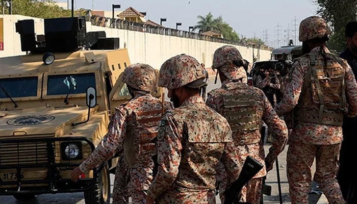 Sindh Rangers personnel standing on the road in Karachi on March 1, 2026. — Reuters
