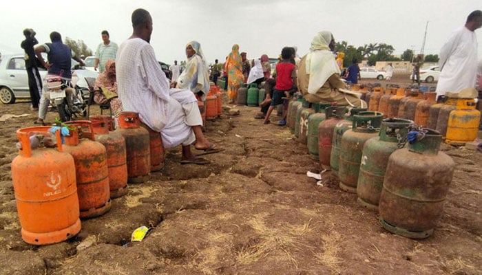 This representational image depicts civilians waiting in long lines to refill cooking gas cylinders amidst a severe fuel crisis in Sudan. — AFP/File