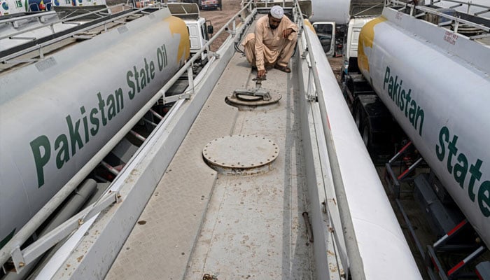 A tanker driver inspecting the tank. —AFP/File