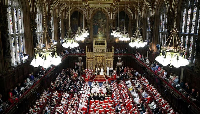 Britains King Charles III, wearing the Imperial State Crown and the Robe of State, reads the Kings Speech from the The Sovereigns Throne in the House of Lords chamber, during the State Opening of Parliament, at the Houses of Parliament, in London, on July 17, 2024.—Reuters